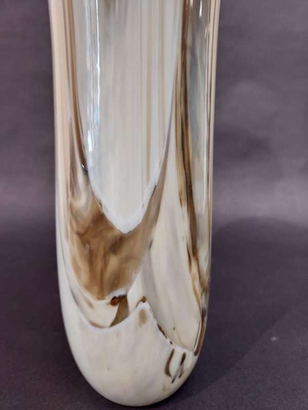 Detail of patter in glass cream brown vase