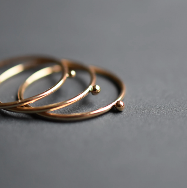 Gold solitaire stacking rings