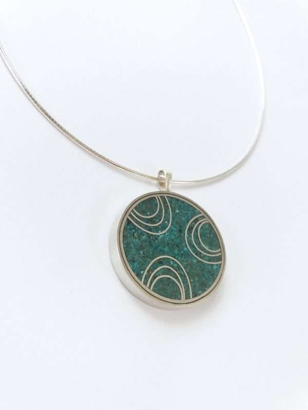 Round silver and turquoise pendant on silver torque