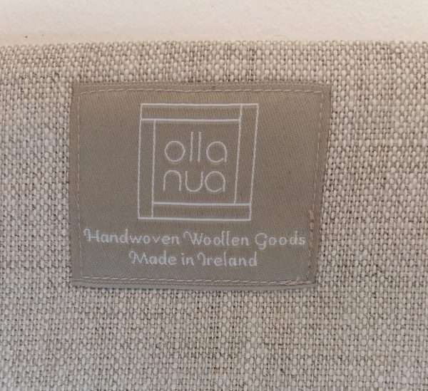 Back of pouch made of Irish linen with maker's label that readys 'Olla Nua' Handwoven goods in in Ireland'.