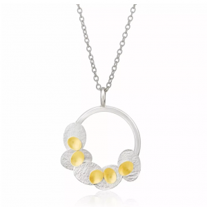 Round silver pendant with 22ct gold detail