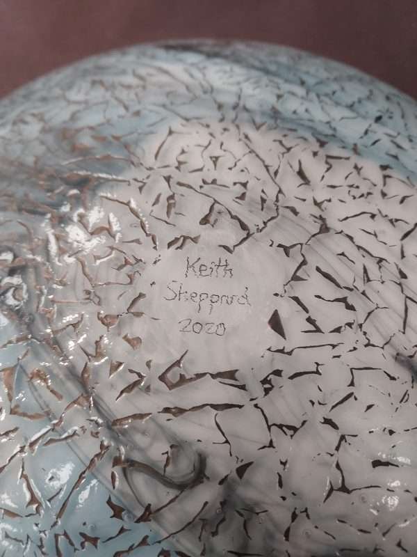 Maker's signature on bottom of Round blue glass plate