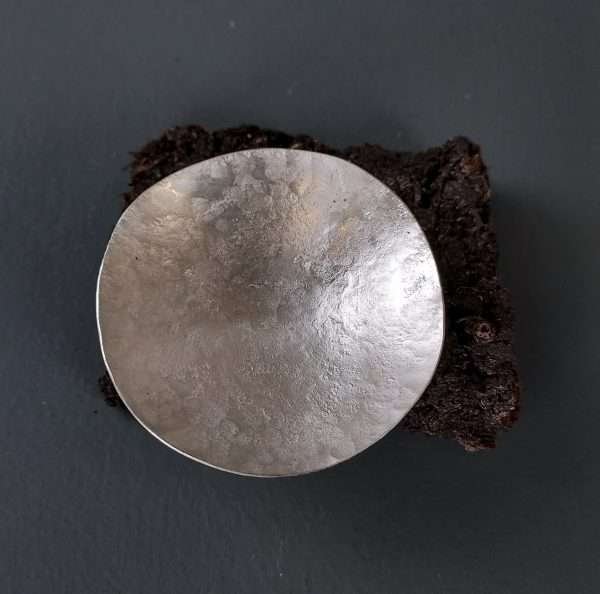 Silver bowl on peat base