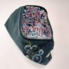 Pattern fabric inside of Dark green textile pouch with zip closure