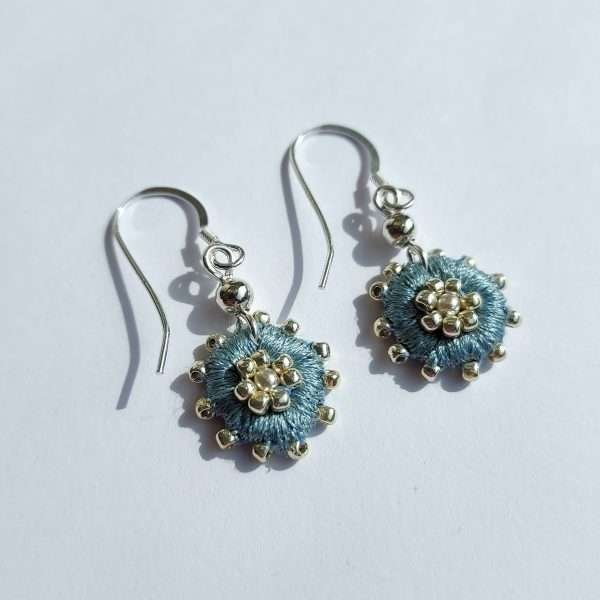 Light blue round embroidered drop earrings