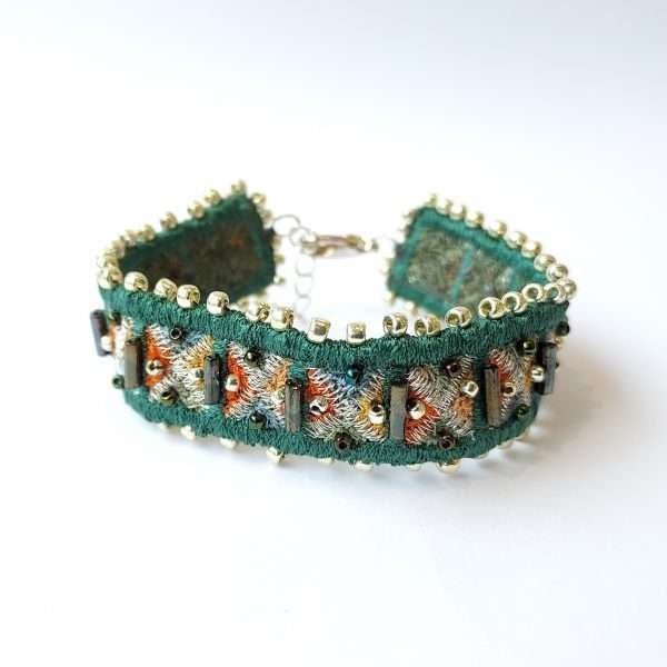 Green embroidered textile bracelet with silver fittings