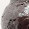 Detail of large brown thrown ceramic earthenware jar