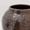 Detail of large brown thrown ceramic earthenware jar