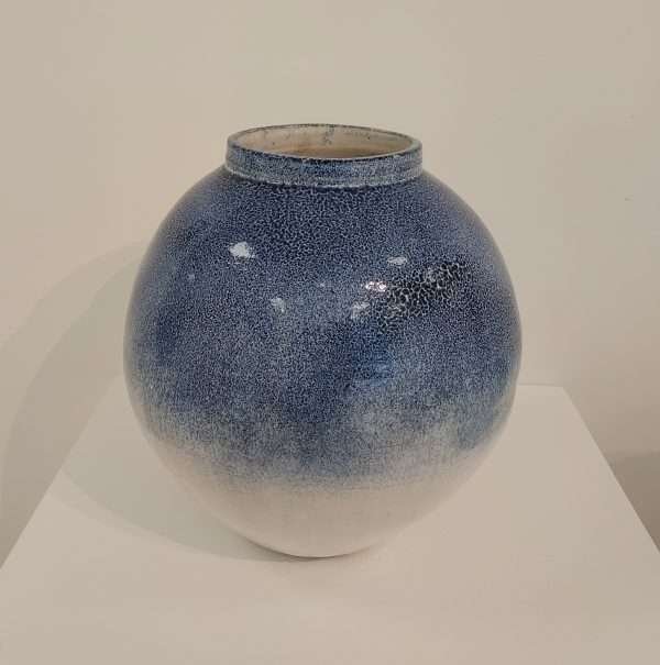Round white and blue stoneware jar