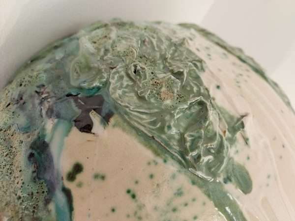 Detail of green glazes on large stoneware jar