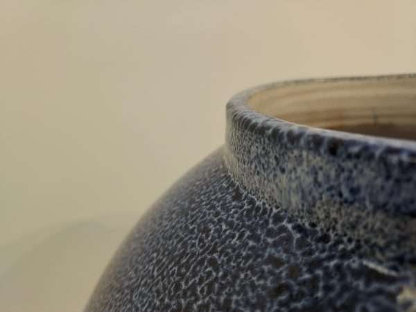Rim of blue stoneware jar