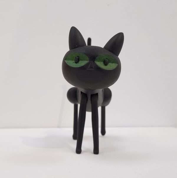 Handmade black wooden toy cat front view