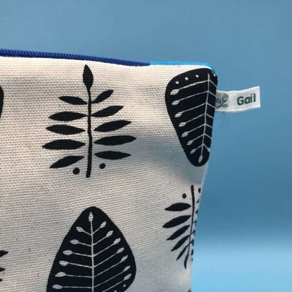 leaf print zip bag showing tag detail