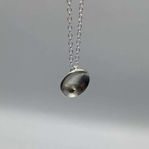 Silver and gold small concave pendant