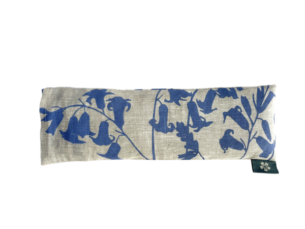 Linen eye pillow printed with a bluebell pattern on natural linen