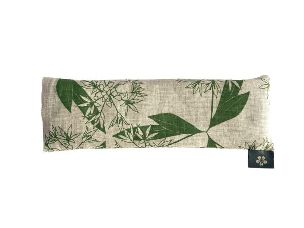 Linen eye pillow printed with a wild garlic pattern in green on natural linen